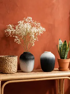 Minimalist black and white gradient resin flower vase for modern home decor and interior staging.