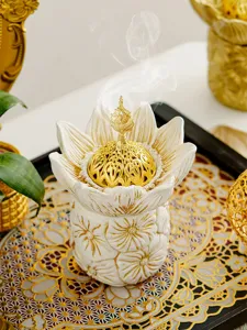 Middle East style lotus incense burner detail view, intricate gold carved lid and white petals.