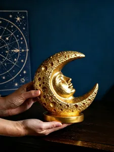 Mid-century vintage moon face resin sculpture close-up, celestial tarot decor detail.