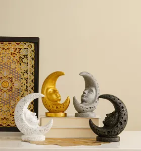 Close-up detail of vintage medieval resin moon face ornaments, celestial tarot sculpture decor.