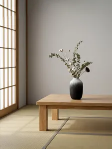 Minimalist black and white gradient resin vase with dried eucalyptus flowers for home decor.