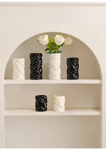 Modern minimalist ceramic braided cylinder vase for home decor, flower arrangement, and art.
