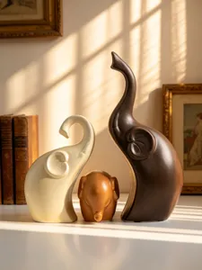 Ceramic elephant family figurine detail view, elegant desktop home decoration ornament.