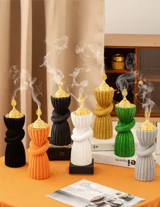 Arabic style resin incense burner set with gold lid, creative twisted design for home decor.