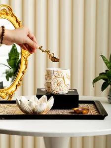 Arabic style ceramic incense burner set with lotus bowl and golden tools for home decor.
