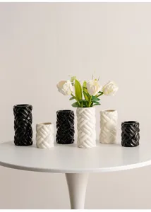 Modern minimalist ceramic vase set for home decor, cylinder woven texture tabletop decor detail.