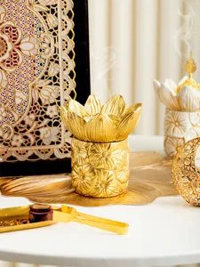Gold Middle Eastern lotus incense burner, creative aromatherapy cone holder for home decor.