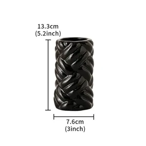 Detailed close-up shot of the black ceramic twisted vase displaying exact dimensions.