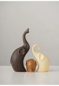 Ceramic elephant family ornament detail showing smooth texture for desktop decor.