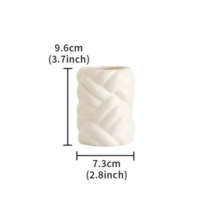 Detailed view of modern minimalist ceramic yarn vase with dimension specs for home decor.