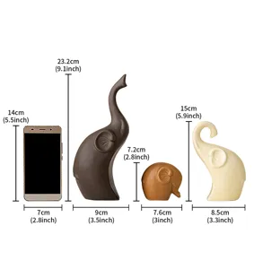 Detailed dimension drawing of minimalist ceramic elephant family ornament for home decor.