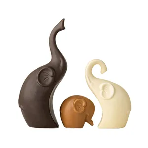 Ceramic elephant ornament detail shot, minimalist family set design for modern desktop decor.