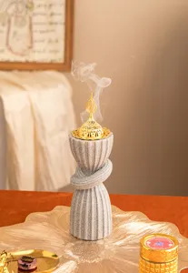 Detailed view of Arabic style resin incense burner with golden hollow lid for home decor.