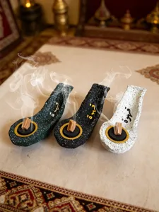 Resin boat incense burner with Arabic calligraphy design, tabletop decorative craft piece detail