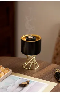 Modern Nordic ceramic incense burner with tall metal stand, elegant desktop home decor.