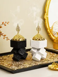Detail shot of Arabic incense burner with gold dome, stacked cubic resin design.