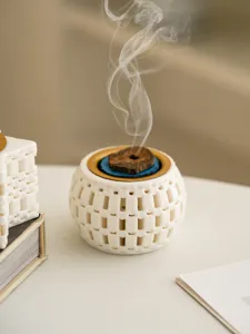 Close-up detail of the creative 3D printed ceramic incense burner emitting fragrant smoke gracefully.