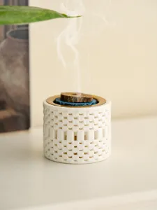 Ceramic incense burner detail close-up showcasing unique 3D printed hollow texture.