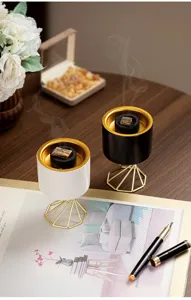 Modern Nordic ceramic incense burner with gold metal stand, elegant home tabletop decor.