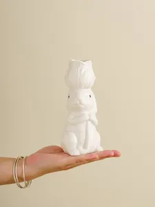Close-up detail of white ceramic rabbit vase showing exquisite craftsmanship and smooth finish.