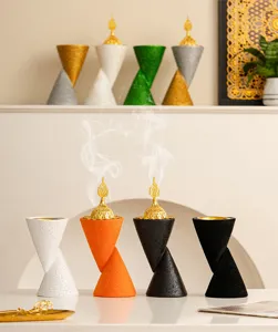 Detail view of double cone resin incense burner, Arabic Arabian bukhoor burner art decor.