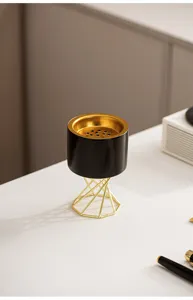 Modern Nordic ceramic incense burner with high metal stand, elegant desktop decor piece.