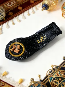 Arabic calligraphy resin boat incense burner detail view, elegant home desktop decor.