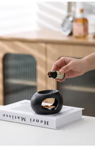 Bruciatore di oli essenziali in ceramica minimalista moderna, lampada a candela per yoga.