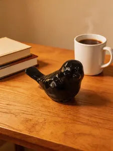 Minimalist black ceramic bird figurine desk ornament, elegant home decor art piece for tabletop.
