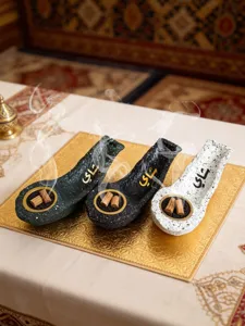 Resin flat boat incense burner with Arabic calligraphy, stylish desktop decorative craft.