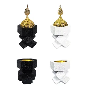 Middle Eastern resin incense burner with cross knot design in black and white colors.