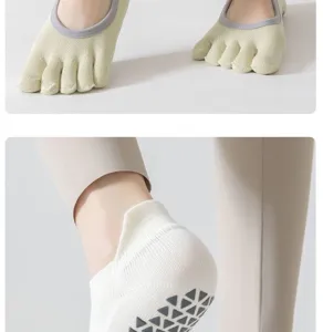 Close-up detail of women's five-toe yoga socks with anti-grip soles for pilates fitness.