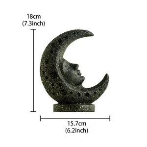 Resin moon face sculpture detail shot, vintage celestial tarot art ornament showing texture.