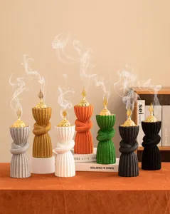 Arabic style resin incense burner with gold dome lid, colorful textured decor craft detail.