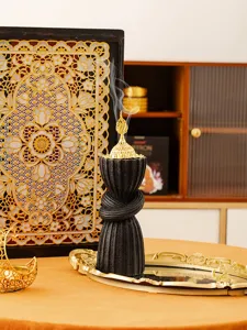 Close-up detail view of the Arabic style resin incense burner, featuring intricate golden top.
