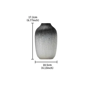 Modern black and white gradient resin vase for minimalist home decor and floral arrangements.