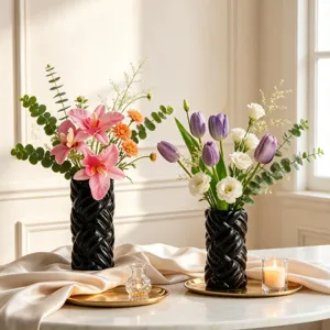 Modern minimalist black ceramic yarn-textured cylinder vase, elegant home floral decor piece.