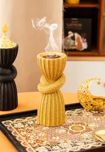 Resin Arabic style incense burner with gold glitter and twist knot design, elegant home decor.