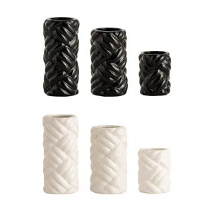 Modern ceramic vase set, cylindrical twisted braided design, black and white home decor.