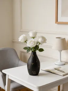 Modern artistic ceramic black vase with gold symbols, perfect desktop flower decor.