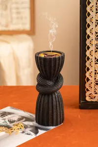 Resin incense burner detail view, Arabic style black matte knotted aromatherapy stove.