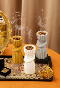 Exquisite resin Arabic incense burner detail view, featuring elegant knot design in multiple colors.