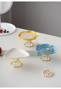 Modern ceramic jewelry tray set with gold metal stand, stylish tabletop organizer.