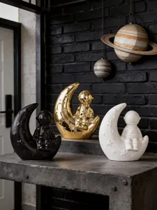 Modern creative astronaut moon ceramic ornament for home desktop and bookshelf decor.