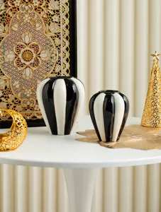 Nordic minimalist black and white striped ceramic vase set for home decor, elegant tabletop display.