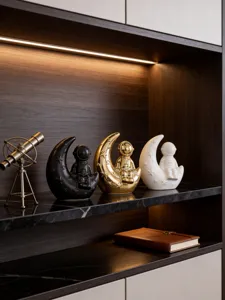 Modern creative astronaut moon ceramic figurine detail view for home bookshelf decor.