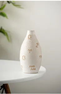 Modern ceramic vase with unique symbol relief design, perfect desktop flower holder home decor.