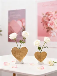 Detailed shot of modern romantic heart-shaped ceramic vase set with golden accent for home decor.