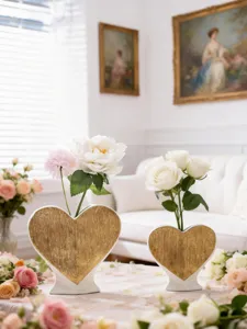 Detail view of romantic heart ceramic vase, luxury gold finish for home decor and floral art.