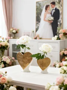 Elegant heart ceramic vase in gold finish, romantic home decor flower holder detail display.